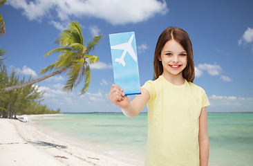 Image showing smiling little girl with airplane ticket