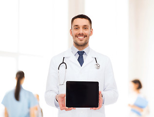 Image showing smiling male doctor with tablet pc