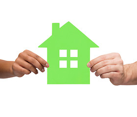 Image showing couple hands holding green house