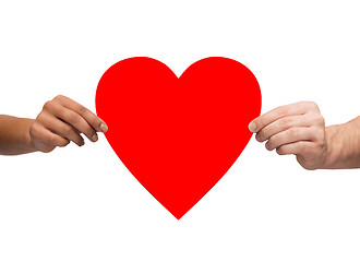 Image showing couple hands holding red heart
