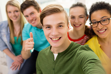 Image showing five smiling students taking selfie at school