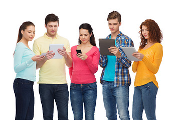 Image showing group of teenagers with smartphones and tablet pc