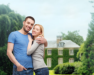 Image showing smiling couple hugging