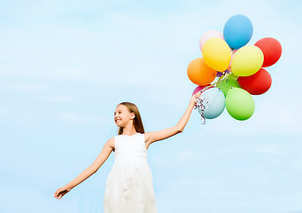 Image showing happy girl with colorful balloons