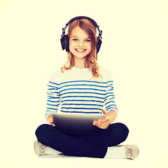 Image showing child with headphones and tablet pc