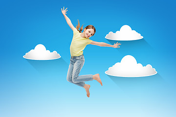 Image showing smiling little girl jumping