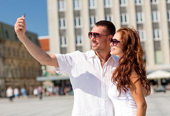 Image showing smiling couple in city