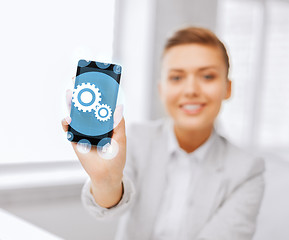 Image showing close up of businesswoman with smartphone