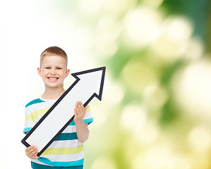 Image showing smiling little boy with blank arrow pointing right