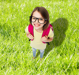 Image showing happy smiling teenage girl in eyeglasses with bag