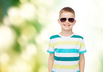 Image showing smiling little boy over green background