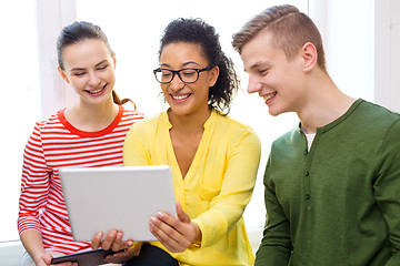 Image showing smiling students with tablet pc at school