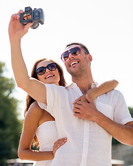 Image showing smiling couple in city