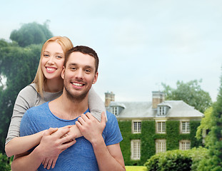 Image showing smiling couple hugging