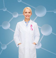 Image showing smiling female doctor with cancer awareness ribbon