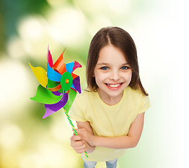 Image showing smiling child with colorful windmill toy