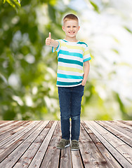 Image showing smiling little boy showing thumbs up