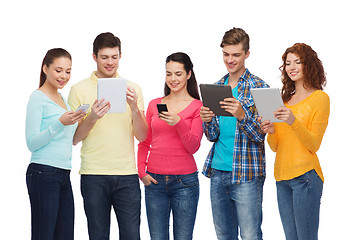 Image showing group of teenagers with smartphones and tablet pc