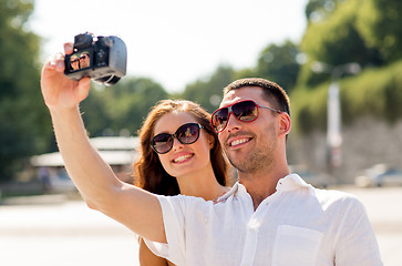 Image showing smiling couple in city