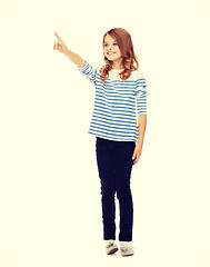 Image showing girl pointing at imaginary screen