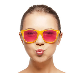 Image showing girl in pink sunglasses blowing kiss