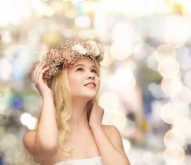 Image showing young woman wearing wreath of flowers