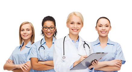 Image showing smiling female doctor and nurses with stethoscope