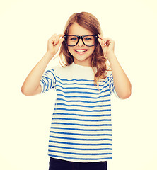 Image showing smiling cute little girl with black eyeglasses