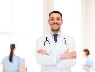 Image showing smiling male doctor with stethoscope