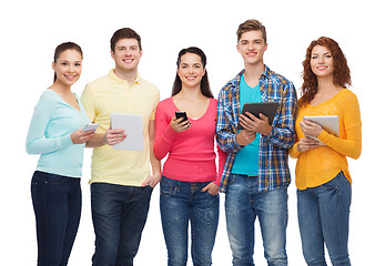 Image showing group of teenagers with smartphones and tablet pc