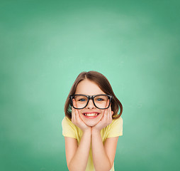 Image showing smiling cute little girl in black eyeglasses