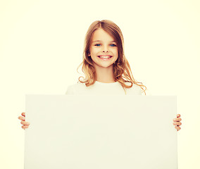 Image showing smiling little girl with blank white board