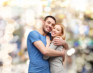 Image showing smiling couple hugging