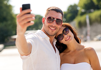 Image showing smiling couple in city