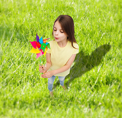 Image showing smiling child with colorful windmill toy