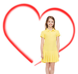 Image showing smiling little girl in yellow dress