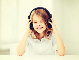 Image showing girl with headphones listening to music