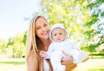 Image showing happy mother with little baby in park