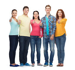 Image showing group of smiling teenagers showing thumbs up