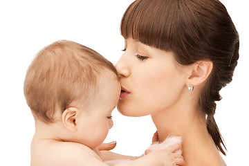 Image showing happy mother kissing baby