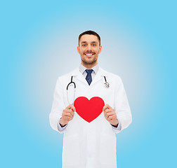 Image showing smiling male doctor with red heart