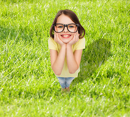 Image showing smiling cute little girl in black eyeglasses