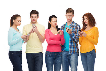 Image showing group of serious teenagers with smartphones