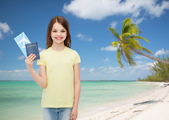 Image showing smiling little girl with ticket and passport