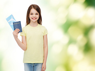 Image showing smiling little girl with ticket and passport