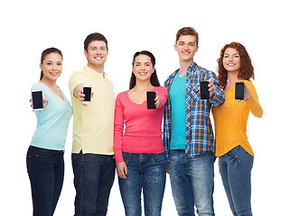 Image showing group of smiling teenagers with smartphones