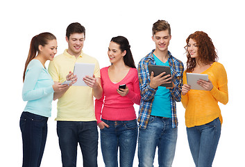 Image showing group of teenagers with smartphones and tablet pc