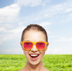 Image showing happy teenage girl in pink sunglasses