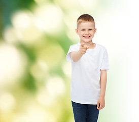 Image showing little boy in white t-shirt pointing his finger