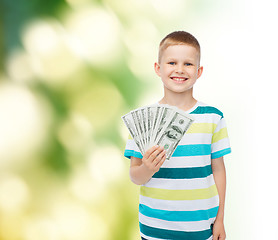 Image showing smiling boy holding dollar cash money in his hand